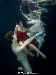 Ship wrecked in Red.  pool with Ballet Dancers by Tina Gutierrez 